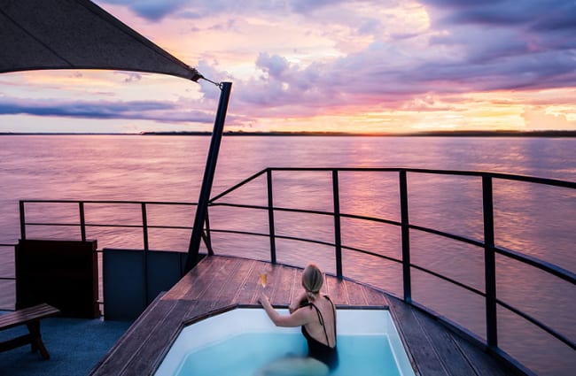 Woman in a Jacuzzi at sunset